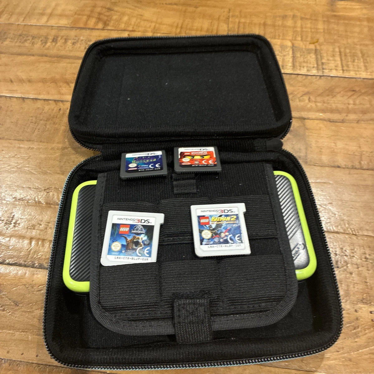 Nintendo 2DS XL Black/Green Bundle w/ Case Charger Stylus & 4 Games (Shown)