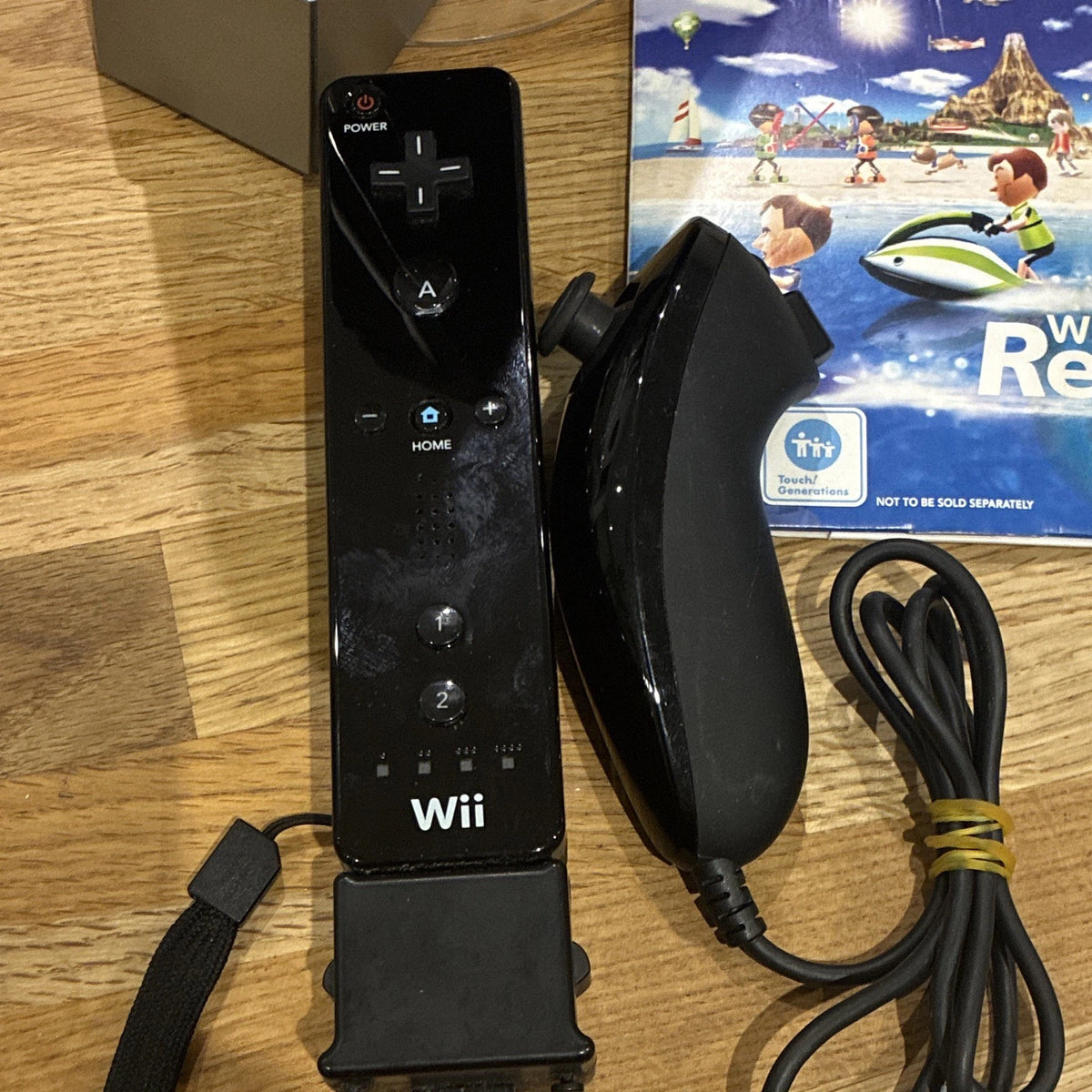 Nintendo Wii Black Console Bundle w/ Remote, Nunchuk & Wii Sports Resort Game